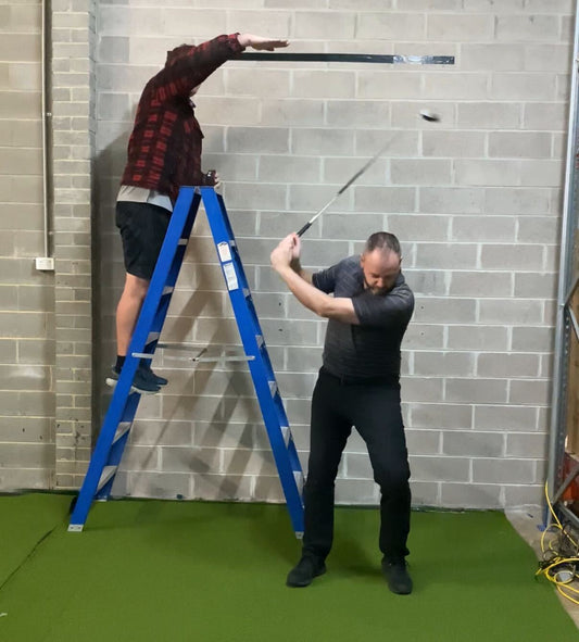 Golfer demonstration swing height